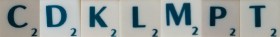 płytki z literami w scrabblach c,d,k,l,m,p,t